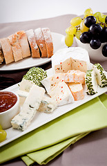 Image showing cheese plate with grapes and wine dinner