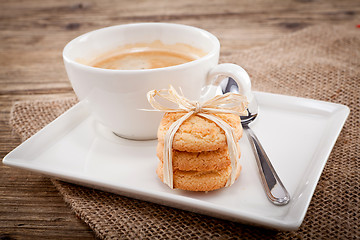 Image showing fresh aromatic coffee and cookies on table