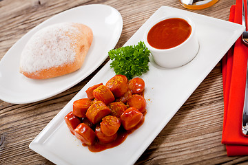 Image showing curry wurst spicy sausage with curry and ketchup