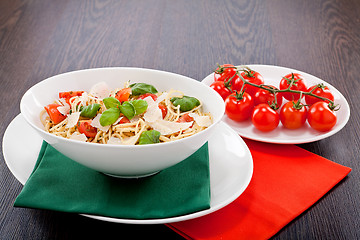 Image showing fresh tasty pasta spaghetti with tomatoes and basil