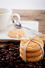 Image showing fresh aromatic coffee and cookies on table