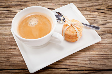 Image showing fresh aromatic coffee and cookies on table