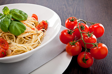 Image showing fresh tasty pasta spaghetti with tomatoes and basil