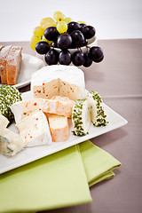 Image showing cheese plate with grapes and wine dinner