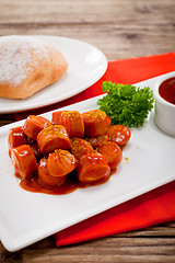 Image showing curry wurst spicy sausage with curry and ketchup