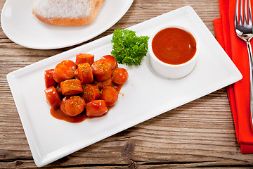 Image showing curry wurst spicy sausage with curry and ketchup