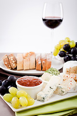 Image showing cheese plate with grapes and wine dinner