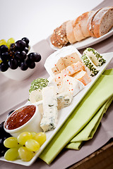 Image showing cheese plate with grapes and wine dinner