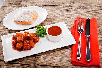 Image showing curry wurst spicy sausage with curry and ketchup