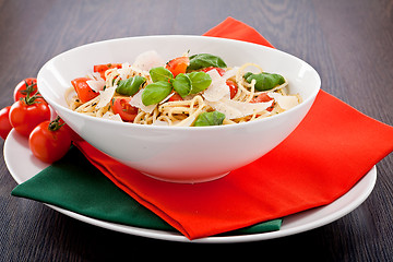 Image showing fresh tasty pasta spaghetti with tomatoes and basil