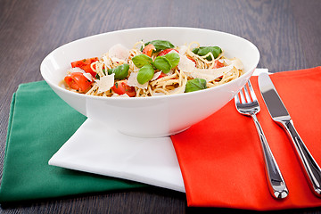 Image showing fresh tasty pasta spaghetti with tomatoes and basil