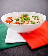 Image showing fresh tasty pasta spaghetti with tomatoes and basil