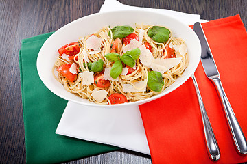 Image showing fresh tasty pasta spaghetti with tomatoes and basil