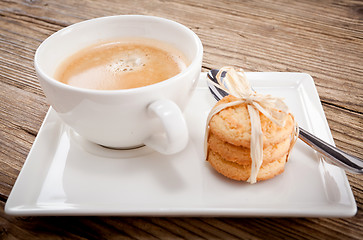 Image showing fresh aromatic coffee and cookies on table