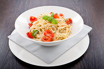 Image showing fresh tasty pasta spaghetti with tomatoes and basil