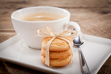 Image showing fresh aromatic coffee and cookies on table