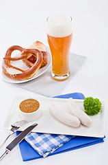 Image showing weisswurst white sausages and sweet mustard with pretzel 