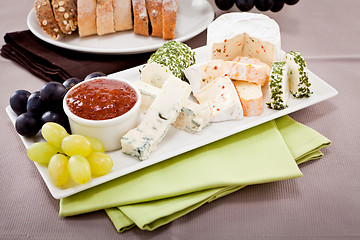 Image showing cheese plate with grapes and wine dinner