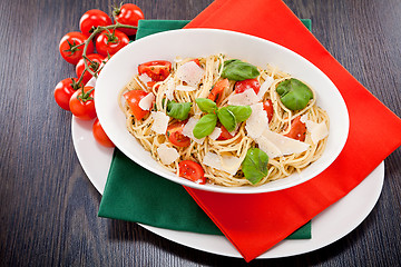 Image showing fresh tasty pasta spaghetti with tomatoes and basil