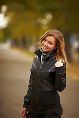 Image showing young brunette woman portrait in autumn color