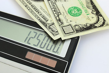 Image showing dollar banknotes and calculator