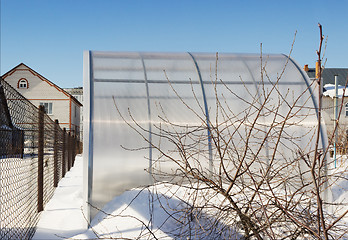 Image showing A small greenhouse is made of polycarbonate winter
