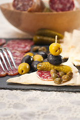 Image showing cold cut platter with pita bread and pickles