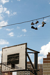 Image showing Sneakers Hanging on a Telephone Line