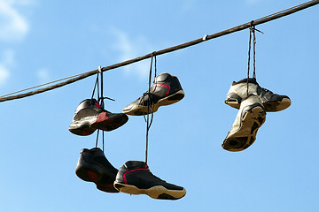 Image showing Sneakers Hanging on a Telephone Line