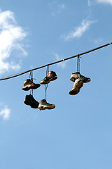 Image showing Sneakers Hanging on a Telephone Line