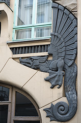Image showing Bas-relief of a dragon on a facade of an old building