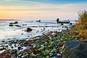 Image showing Fishing boats on the coast of the Baltic Sea at sunset