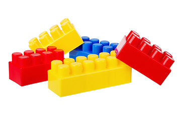 Image showing Multi-coloured Plastic building blocks, it is isolated on white