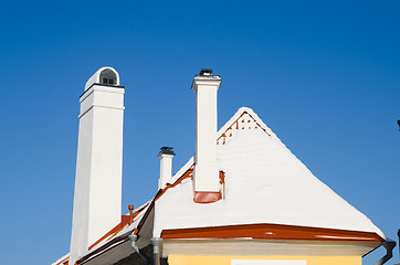 Image showing Chimneys and roof brought by a snow, a close up