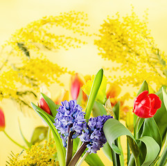 Image showing Bouquet with spring flowers and a mimosa