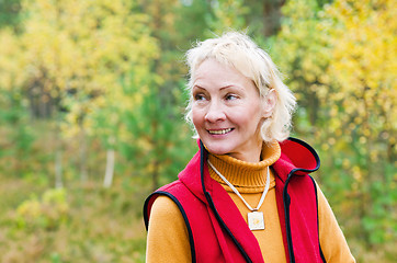 Image showing Portrait of a woman middle aged outdoors in fall 