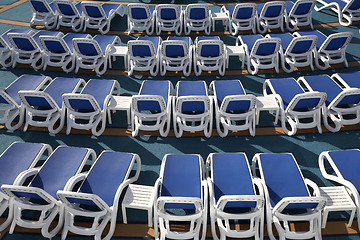 Image showing empty sun loungers