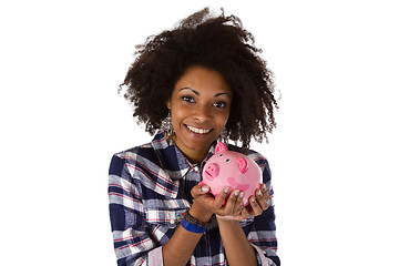 Image showing Young african american woman with piggy bank