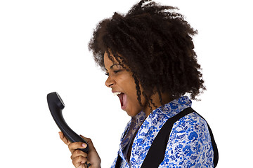 Image showing Angry african american woman with handset