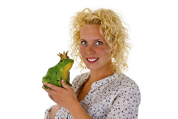 Image showing Young woman kissing a frog prince