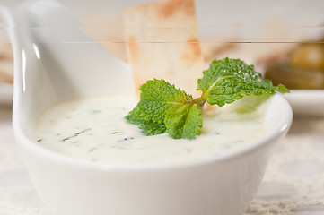 Image showing Greek Tzatziki yogurt dip and pita bread