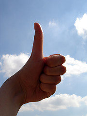 Image showing Thumbs up with cloud background