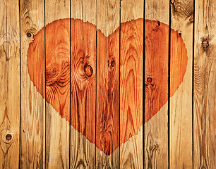 Image showing Silhouette of heart on wooden wall