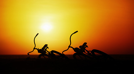 Image showing Concept of romance and love - pair vintage bicycles at sunset