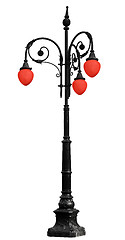 Image showing Vintage iron lamppost with red light isolated on white