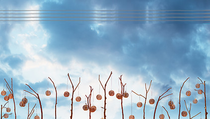 Image showing Round wooden vintage lanterns on sky background