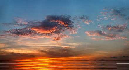 Image showing Bright clouds at sunset light 