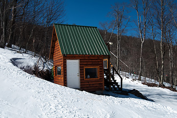 Image showing log cabin in snow