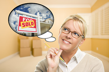 Image showing Woman in Empty Room with Thought Bubble of Sold Real Estate Sign