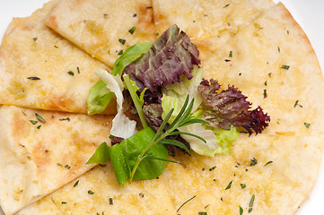 Image showing garlic pita bread pizza with salad on top